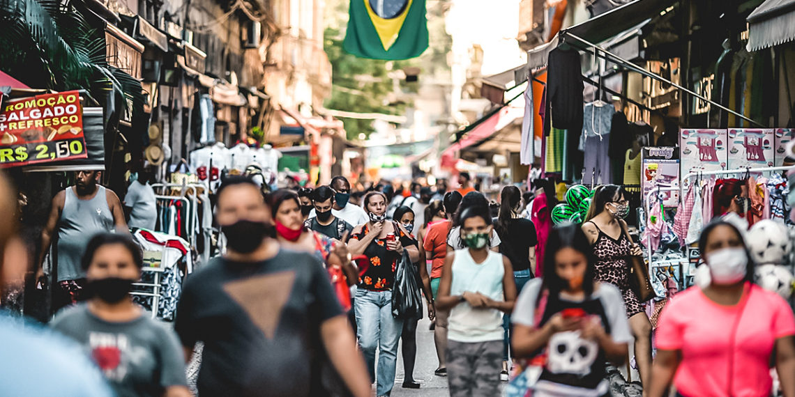 Pedestrians wearing protective masks walk on Alfandega Street in Rio de Janeiro, Brazil, on Thursday, July 23, 2020. Brazil registered 67,860 new cases on Wednesday, more than 20% above the previous record for daily infections. Photographer: Andre Coelho/Bloomberg