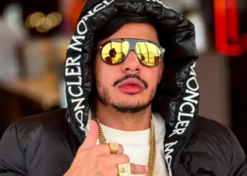 Rapper Hungria está internado em Brasília com suspeita de intoxicação por metanol após consumir bebidas em casa de shows interditada em São Paulo. Artista apresenta melhora.